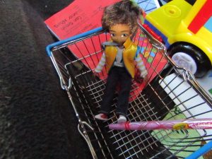 doll, basket, car, toys in basket, pencil